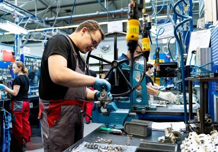 Automotive parts processing worker